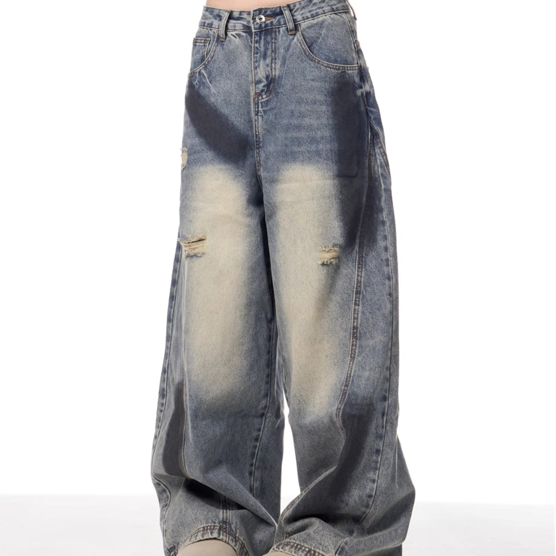 Distressed blue jeans on a white background